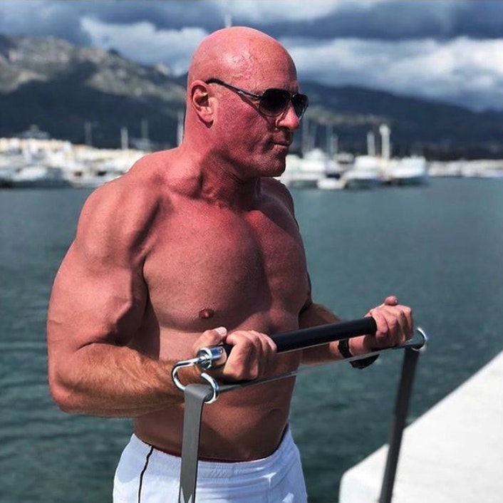 John Jaquish performs a bicep curl outside with X3