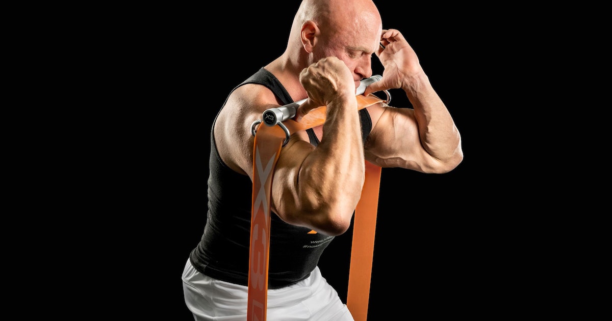 John Jaquish performs a banded front squat