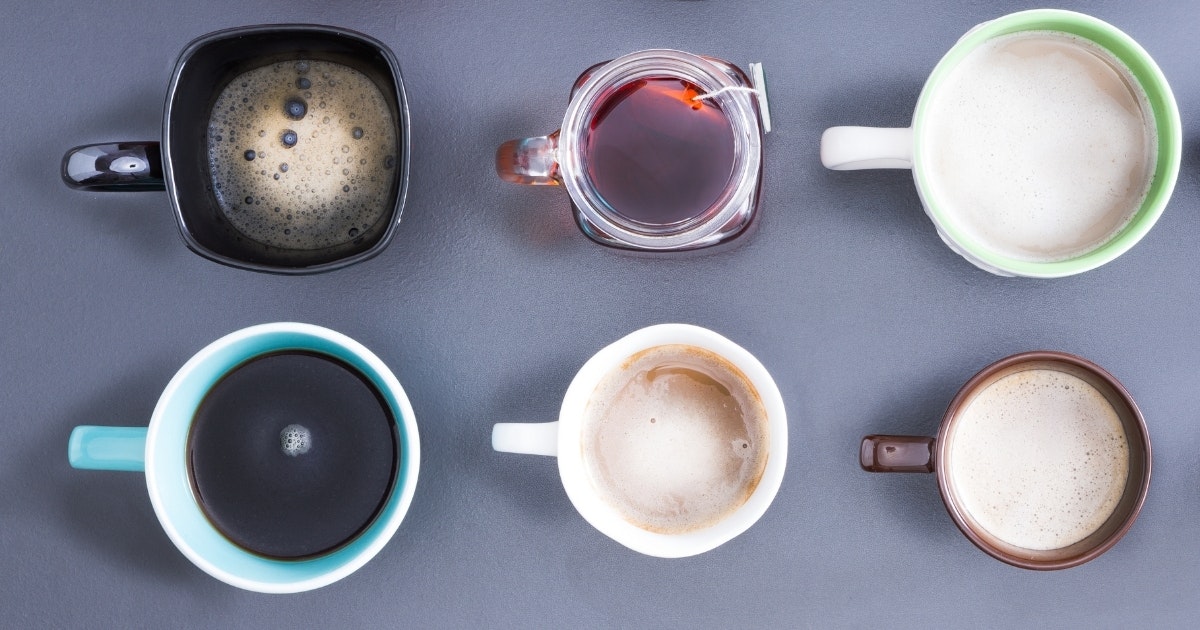 Six hot beverages in mugs on a table