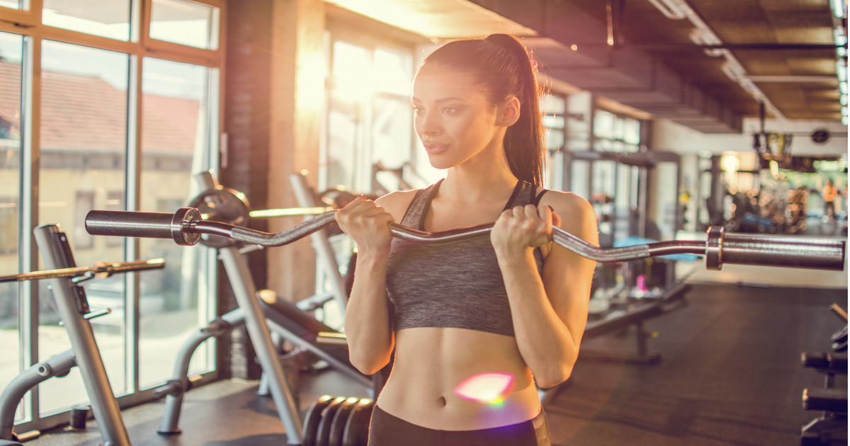woman using bicep curl band bar