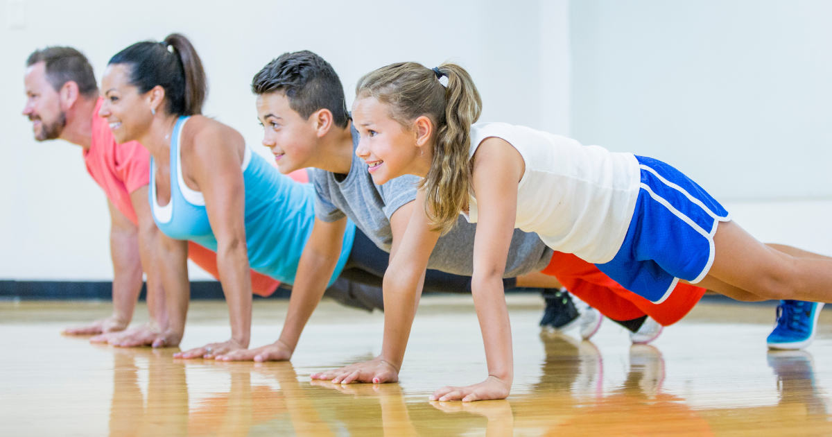 Kids and adults doing pushups