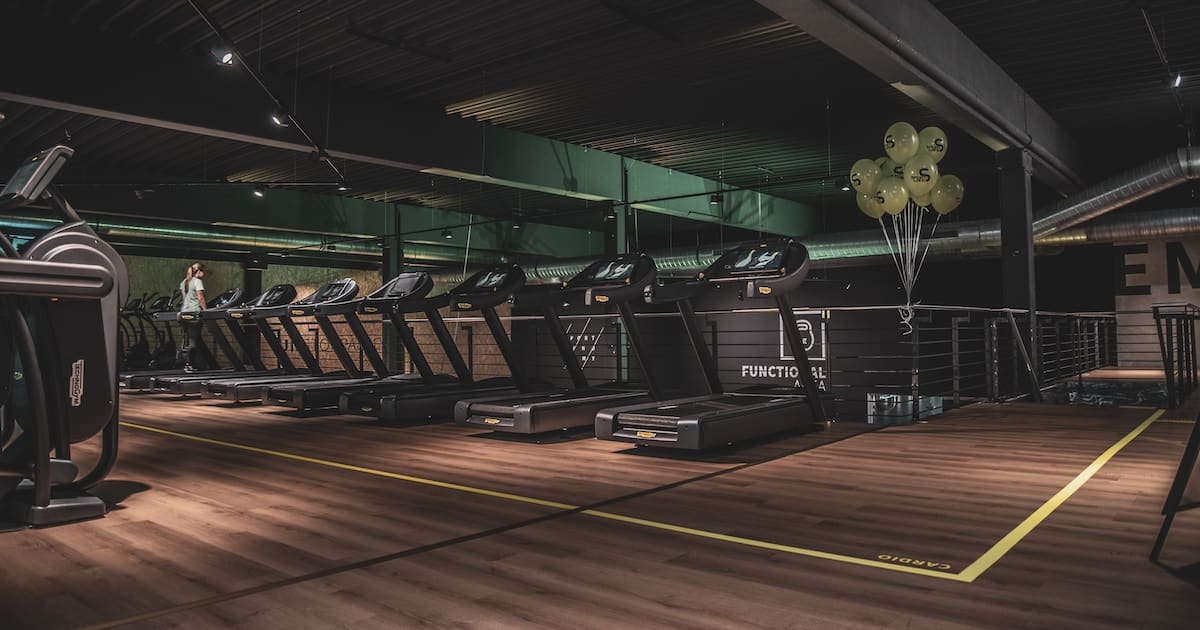A row of treadmills in a gym
