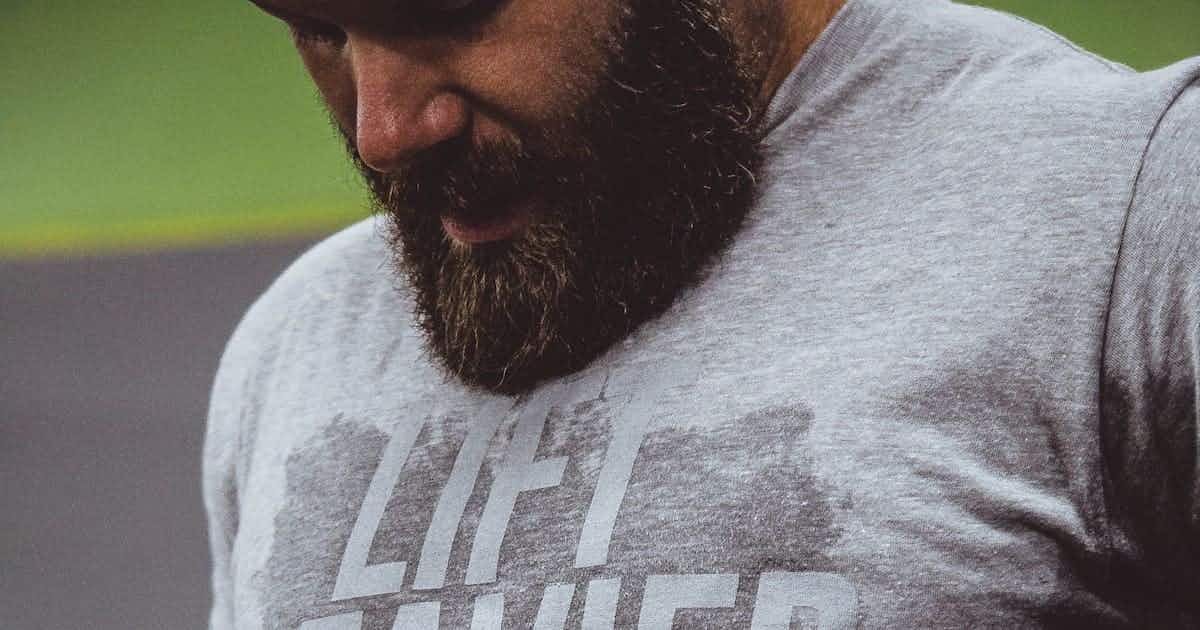 Man catching breath after home workout