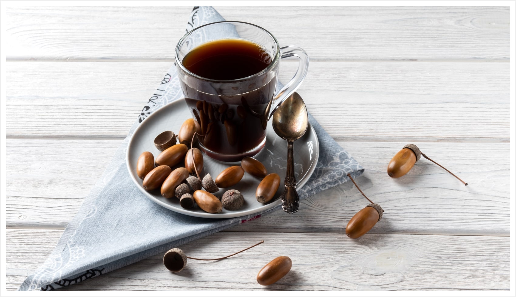 Espresso cup and coffee beans on handkerchief