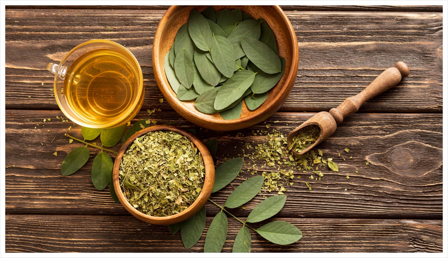 Tea leaves in cups on a wooden table