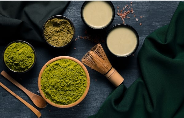 Matcha in several cups on a table