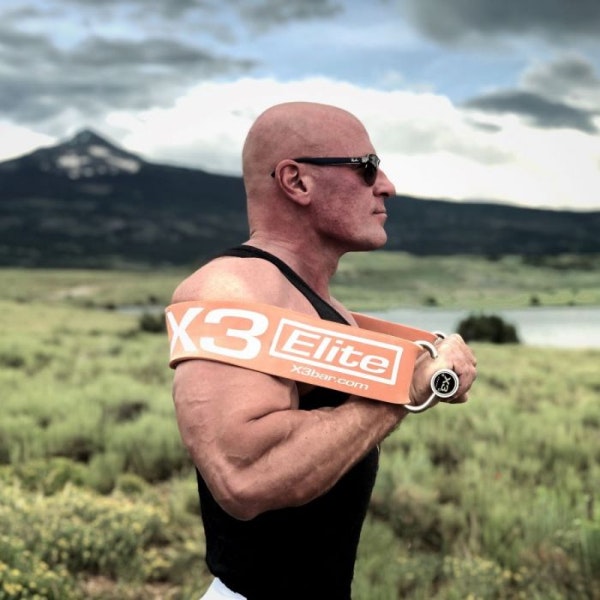 Dr. Jaquish doing chest press with X3 outside