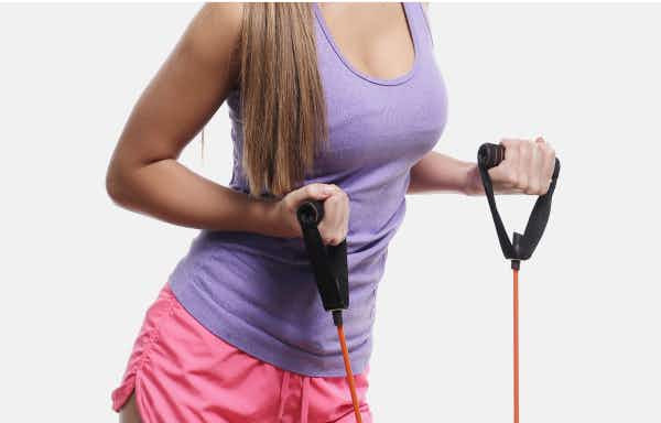Woman doing bicep curls with handles