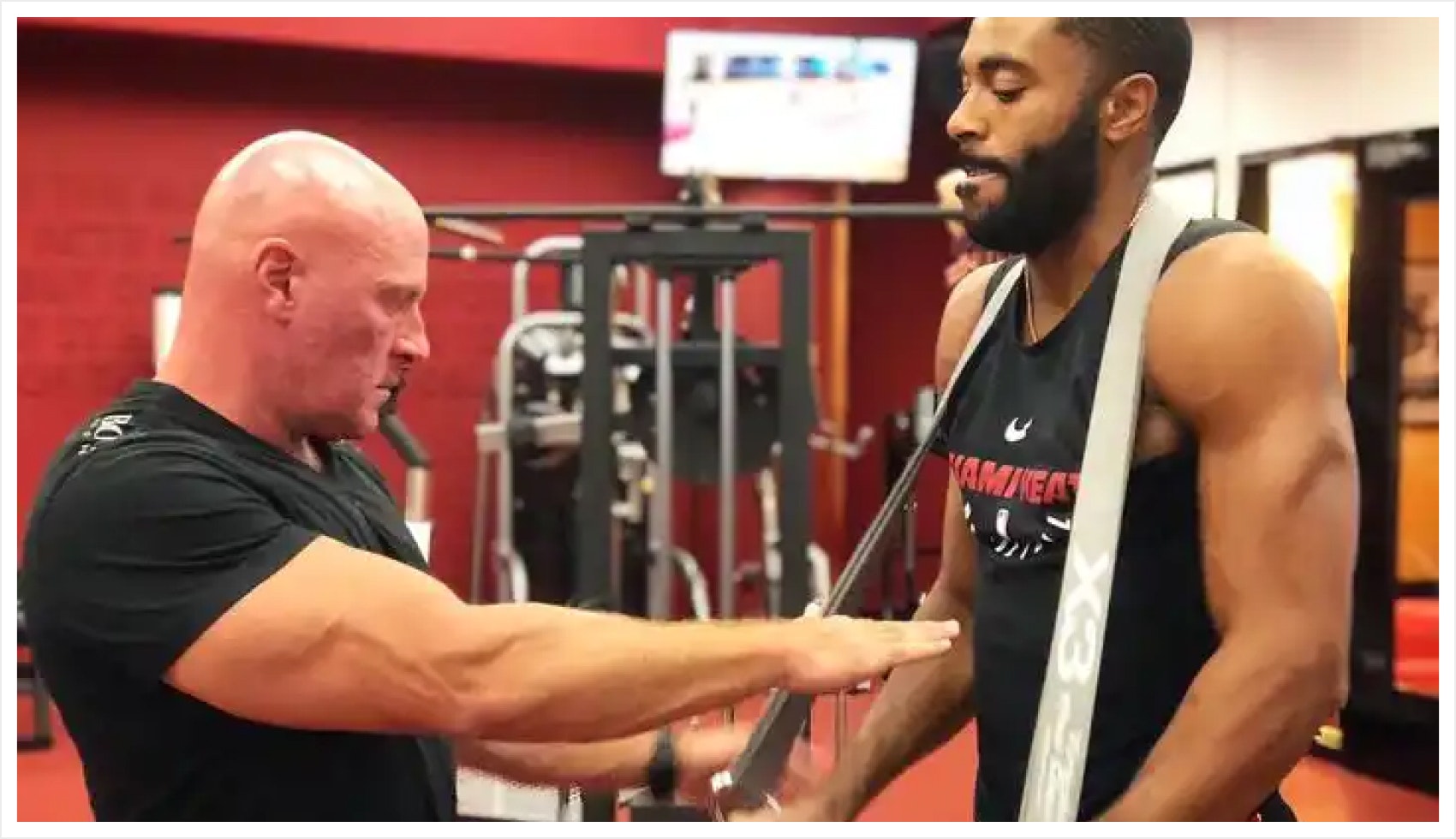 Dr. Jaquish helping athlete with X3 Bar