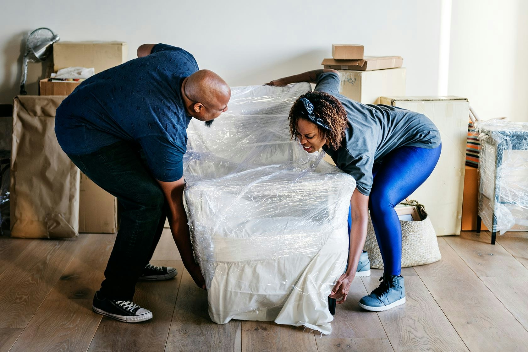 couple lifting armchair